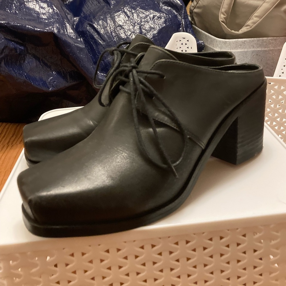 Intentionally _____ Blank black leather mules size10
